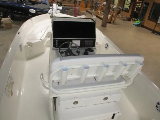 Slide: The Image of 2025 Skeeter SX2350 boat interior with steering console and rod holders. - 6