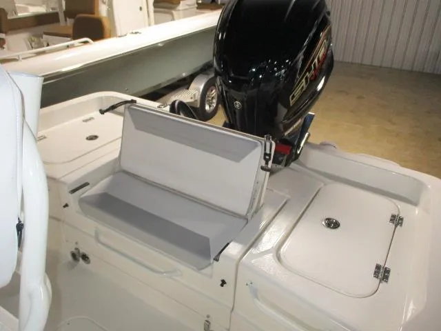 Slide: The Image of 2025 Skeeter SX2350 boat interior with motor and storage compartments. - 7