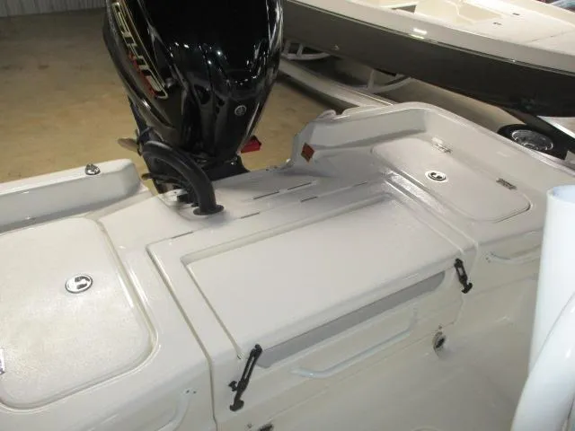 Slide: The Image of 2025 Skeeter SX2350 boat interior with motor, showcasing storage compartments. - 9