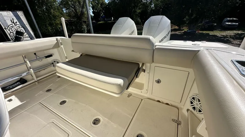 Slide: The Image of 2023 Boston Whaler 250 Outrage boat interior with seating and storage compartments. - 4