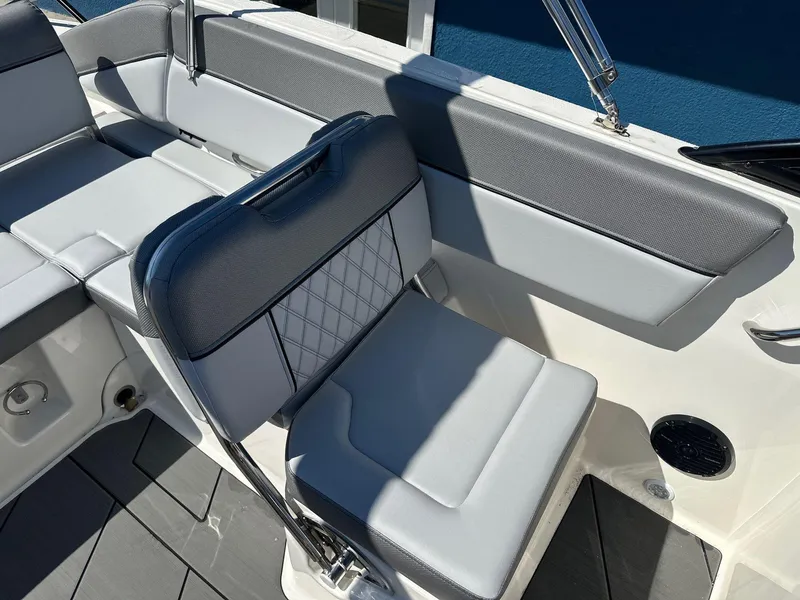 Slide: The Image of 2025 Bayliner D22 boat interior with gray seating and modern design. - 13