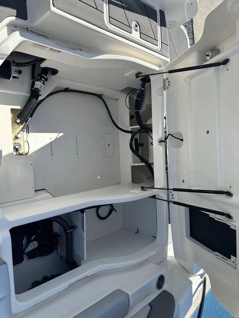 Slide: The Image of 2025 Bayliner D22 boat interior storage compartments, showcasing spacious design and organized layout. - 15