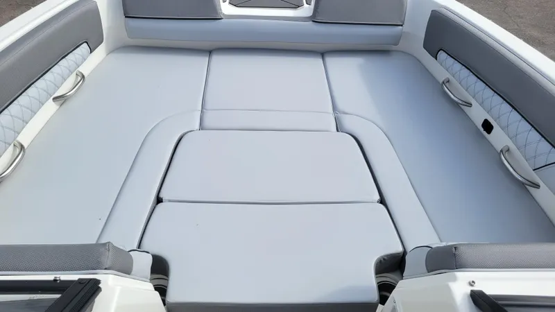 Slide: The Image of 2025 Bayliner D22 boat interior with cushioned seating and sleek design. - 17