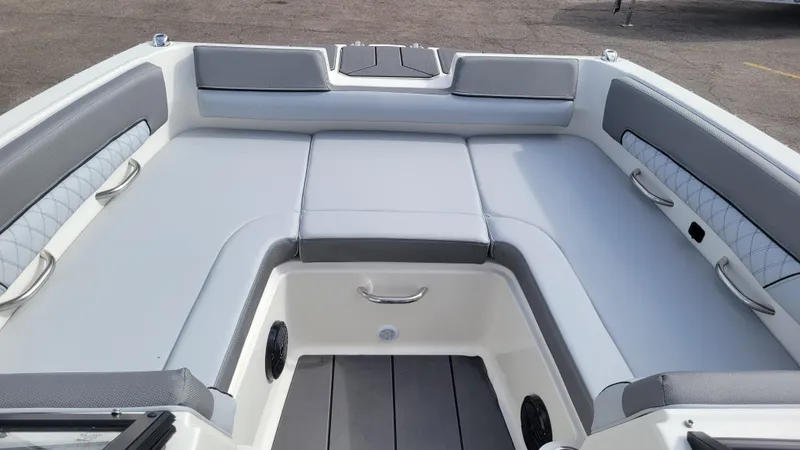 Slide: The Image of 2025 Bayliner D22 boat interior with gray cushioned seating and modern design. - 18