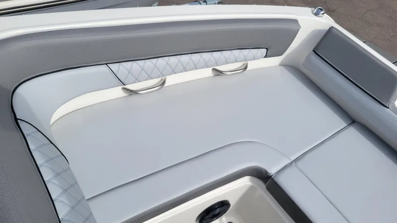 Slide: The Image of 2025 Bayliner D22 boat interior with sleek, modern seating and stylish design. - 19