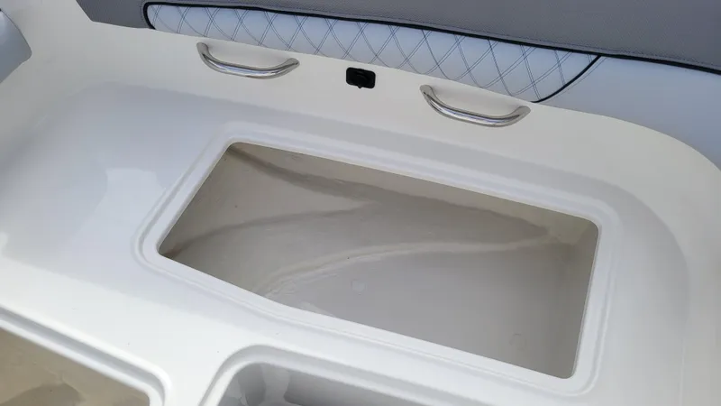 Slide: The Image of Interior view of 2025 Bayliner D22 boat, featuring sleek storage compartment design. - 24