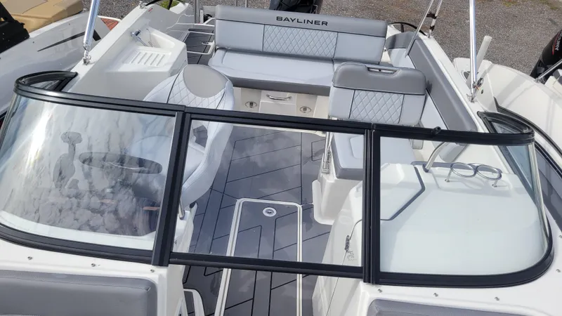 Slide: The Image of 2025 Bayliner D22 boat interior with seating and steering console. - 30