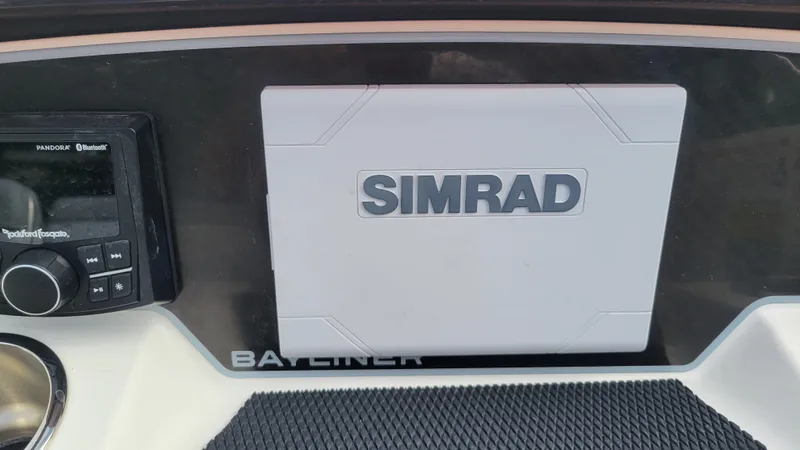 Slide: The Image of 2025 Bayliner D22 dashboard featuring Simrad navigation system. - 33