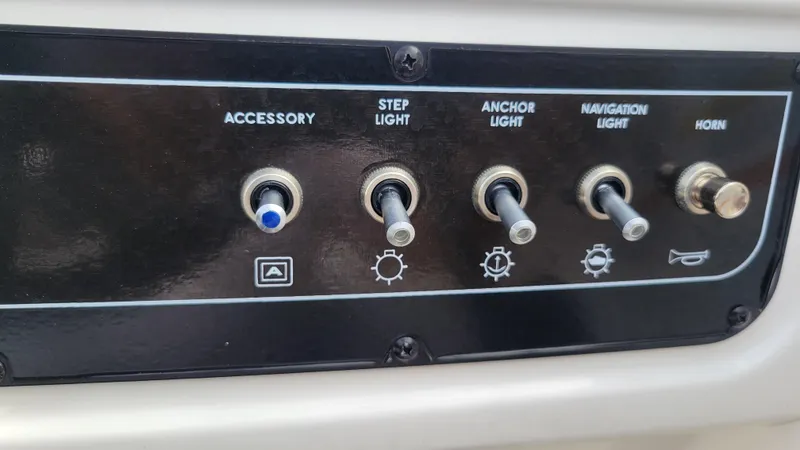 Slide: The Image of Control panel of 2025 Bayliner D22 boat with switches for lights and horn. - 36