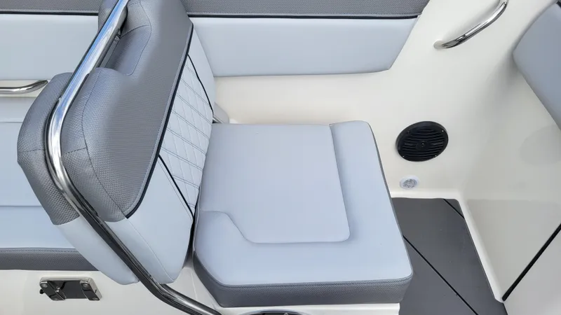 Slide: The Image of 2025 Bayliner D22 boat seat with gray and white upholstery, featuring a sleek design. - 47