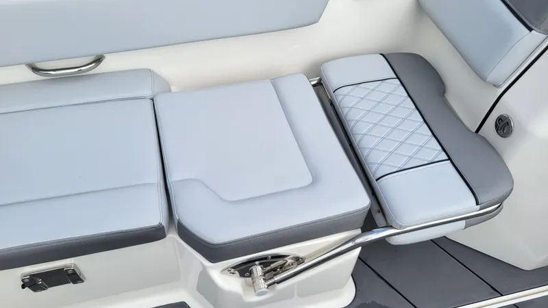 Slide: The Image of 2025 Bayliner D22 boat seating with modern design and quilted upholstery. - 49