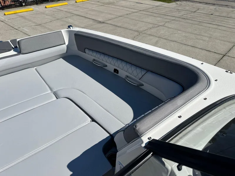 Slide: The Image of 2025 Bayliner D22 boat interior with gray cushioned seating. - 9