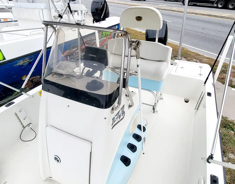 Slide: The Image of 2006 Triton 190 LTS boat interior with steering console and seating. - 5