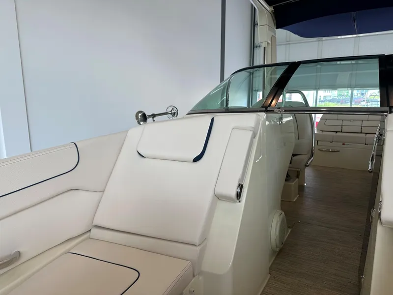 Slide: The Image of 2024 Chris-Craft Launch 28 GT interior, featuring sleek white seating and modern design. - 30