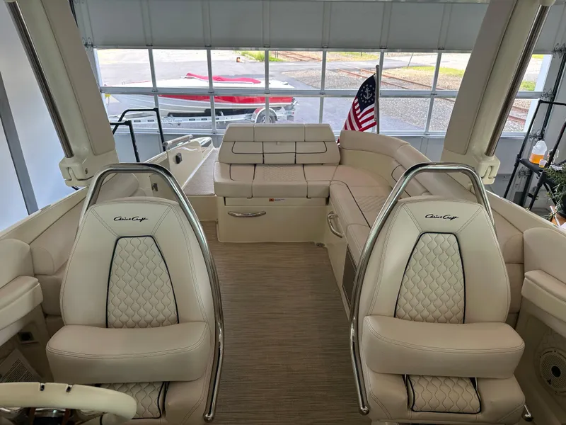 Slide: The Image of 2024 Chris-Craft Launch 28 GT interior with luxurious seating and American flag. - 31
