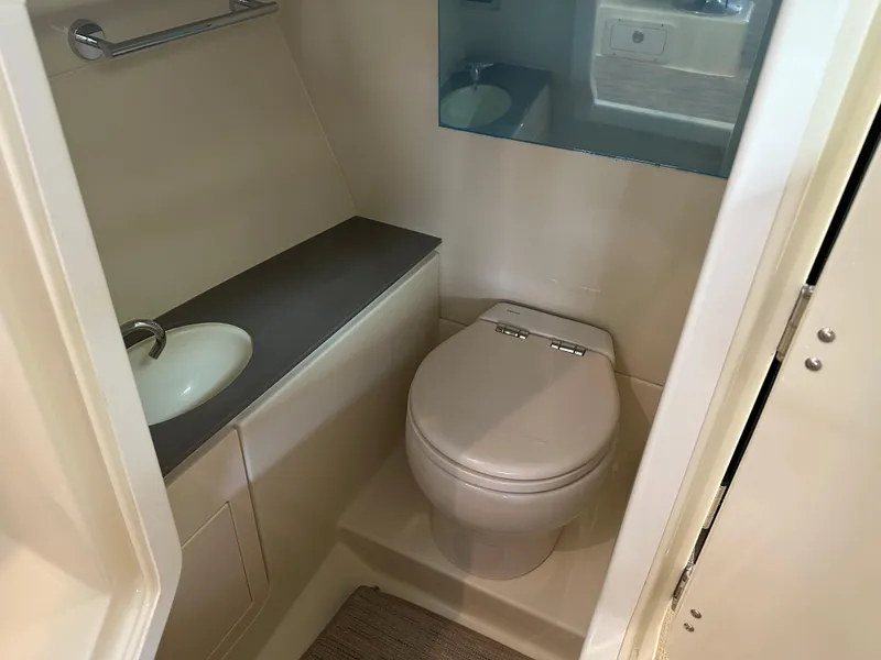 Slide: The Image of 2024 Chris-Craft Launch 28 GT boat bathroom with toilet and sink. - 35