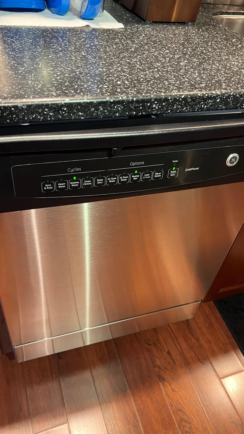 Slide: The Image of Stainless steel dishwasher with control panel, set in a modern kitchen. - 11