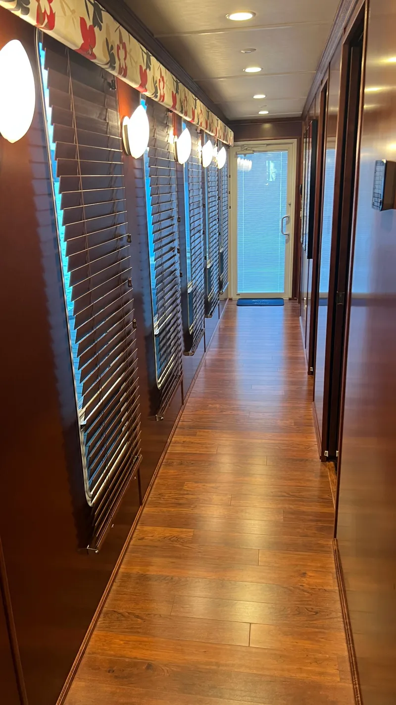 Slide: The Image of Luxurious interior hallway of 2008 Monticello River Yacht with wooden flooring and elegant lighting. - 13