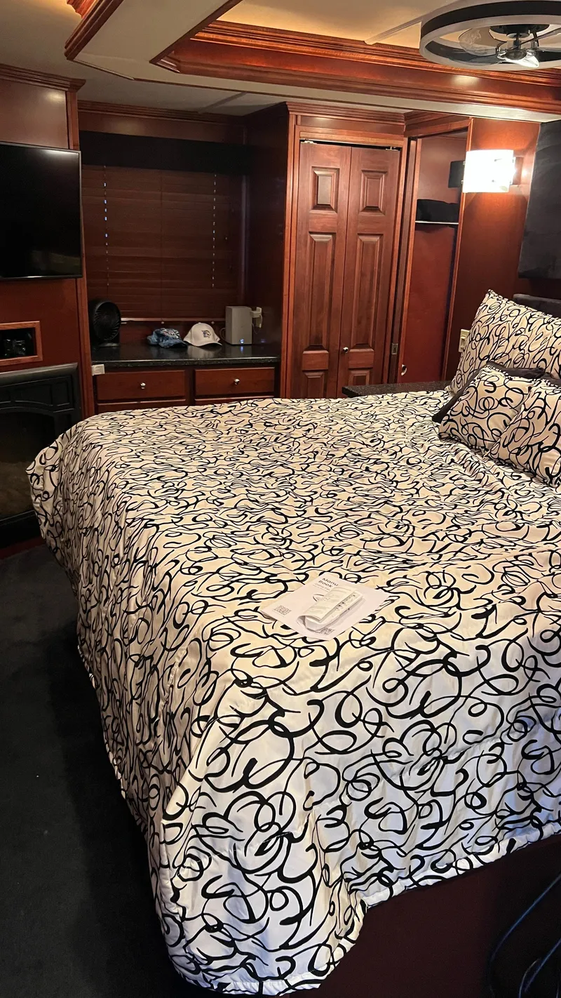 Slide: The Image of Luxurious bedroom interior of 2008 Monticello River Yacht with elegant bedding and wood accents. - 17