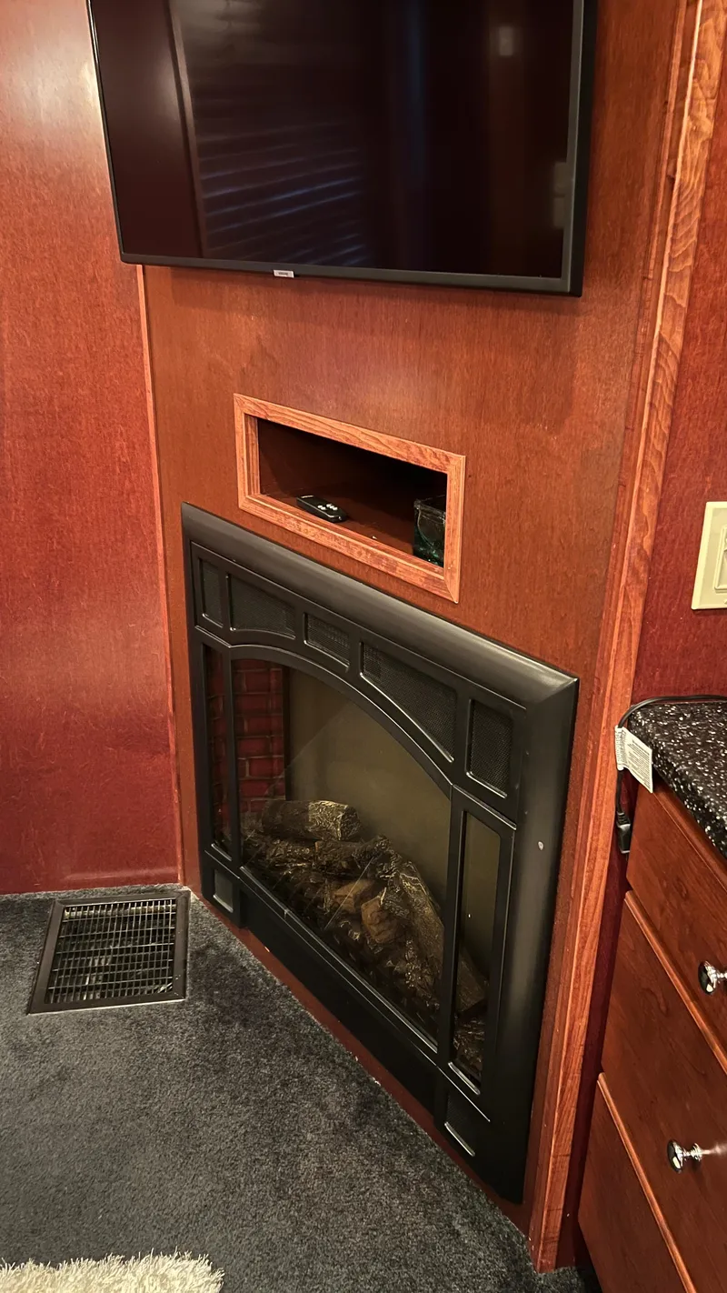 Slide: The Image of Luxurious 2008 Monticello River Yacht interior with fireplace and TV. - 18