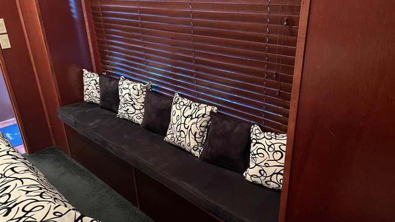 Slide: The Image of Luxurious 2008 Monticello River Yacht interior with elegant seating and decorative pillows. - 19