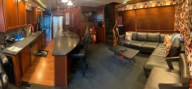 Slide: The Image of Luxurious 2008 Monticello River Yacht interior with modern kitchen and cozy living area. - 24