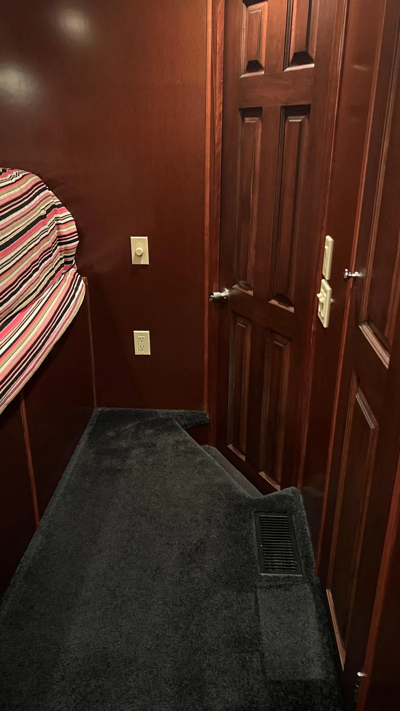 Slide: The Image of Interior of 2008 Monticello River Yacht with wood paneling and carpeted floor. - 25