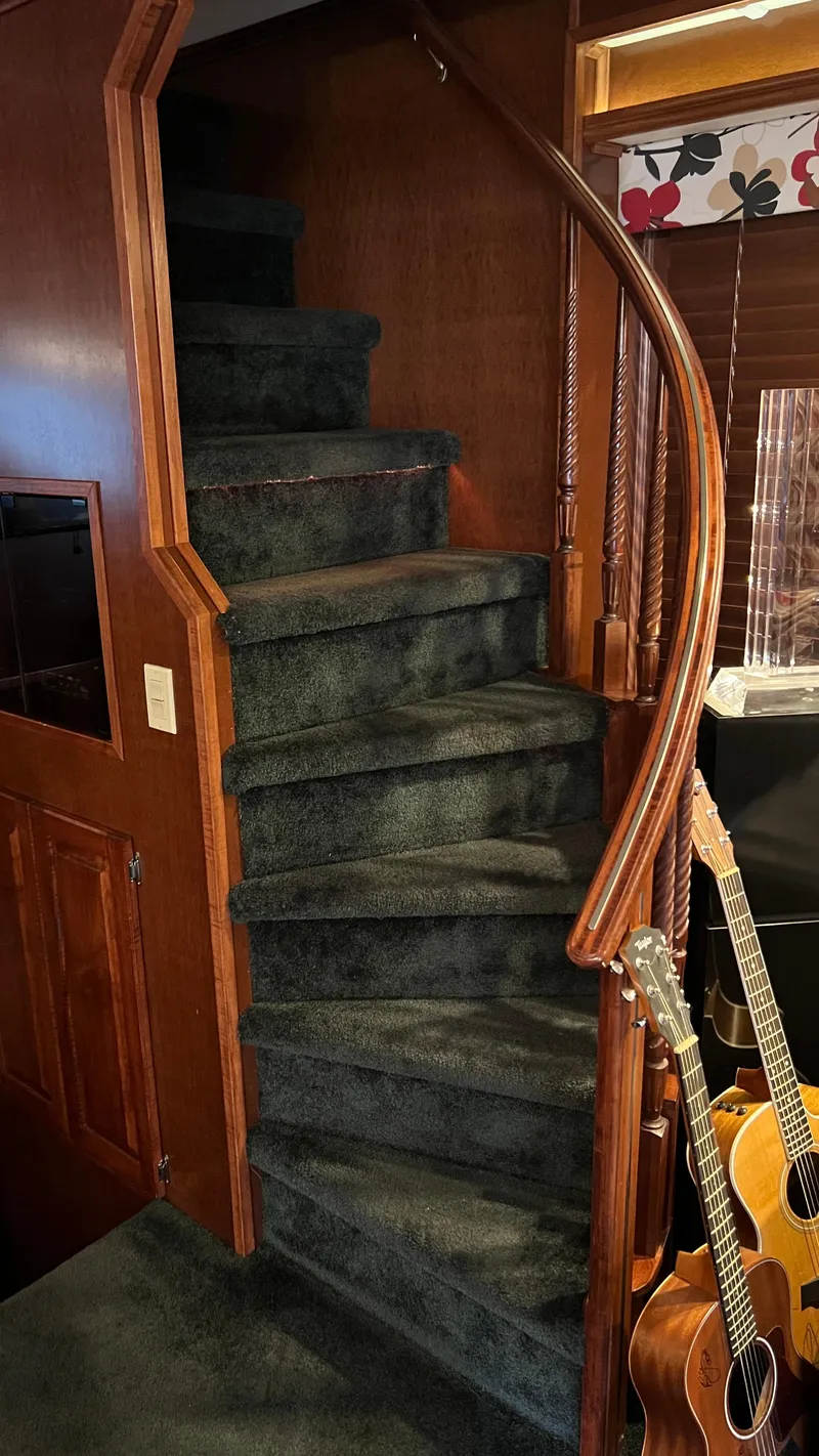Slide: The Image of Curved staircase with green carpet in 2008 Monticello River Yacht interior. - 27
