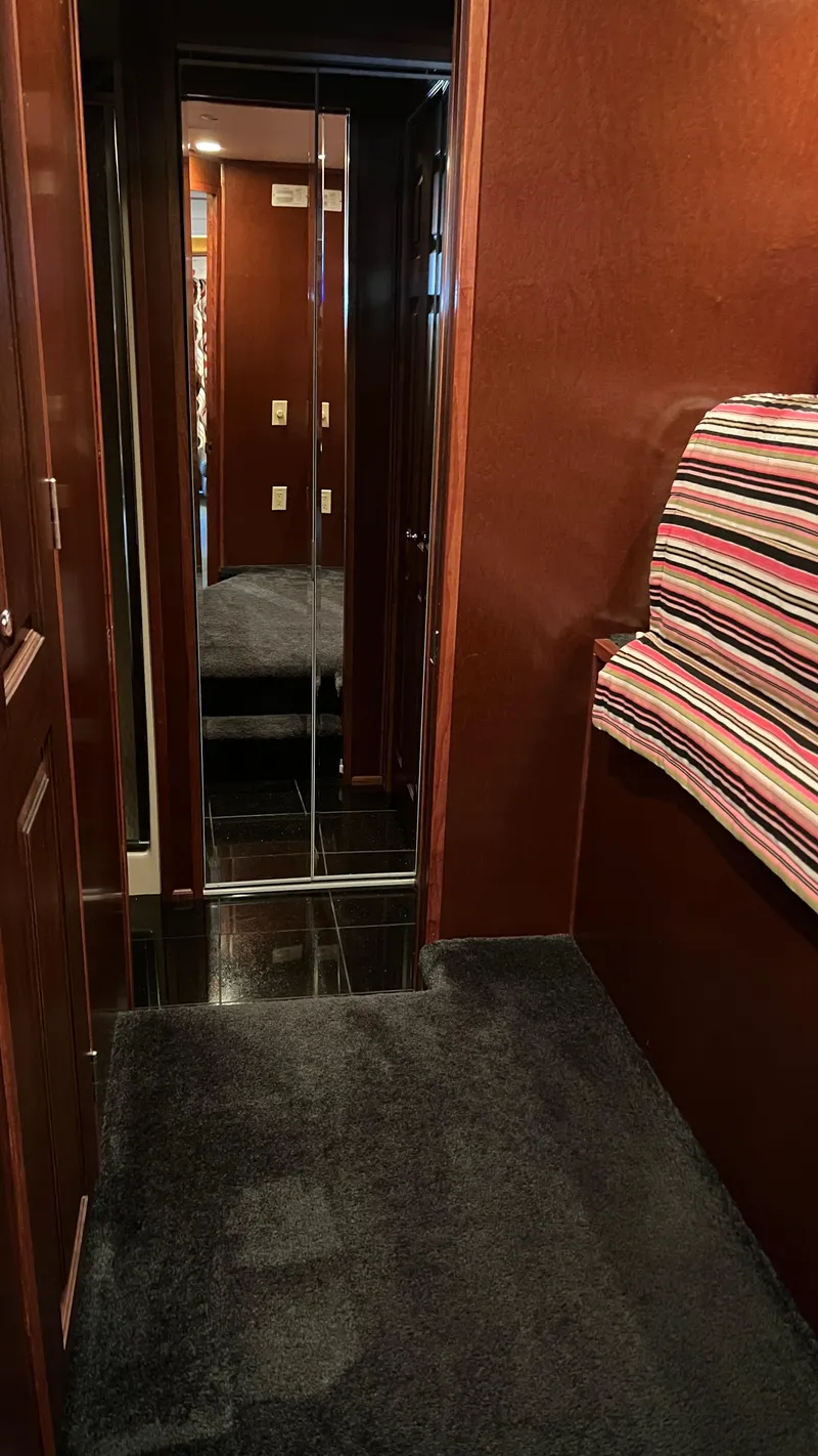 Slide: The Image of Luxurious interior hallway of 2008 Monticello River Yacht with plush carpet and mirrored door. - 33