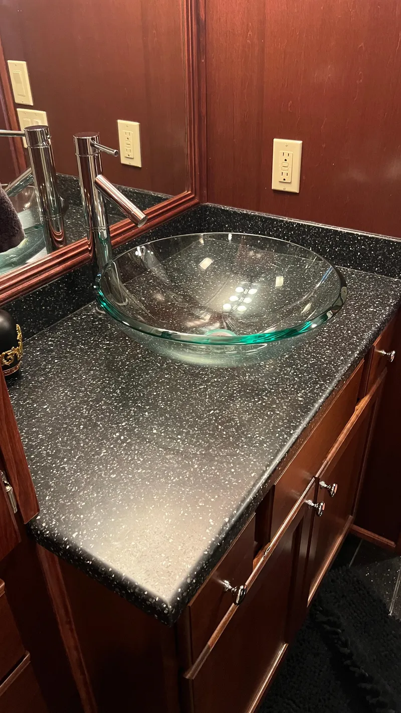 Slide: The Image of Luxurious bathroom sink with glass basin on Monticello River Yacht, 2008 model. - 37