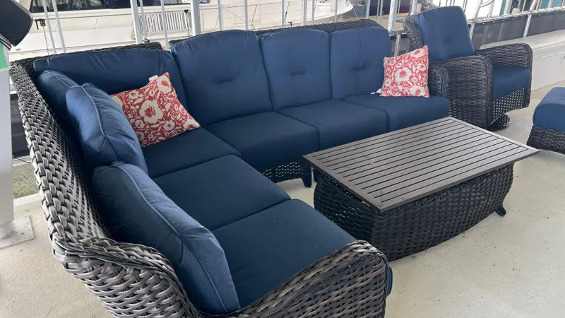 Slide: The Image of Wicker patio furniture with blue cushions on a 2008 Monticello River Yacht. - 38
