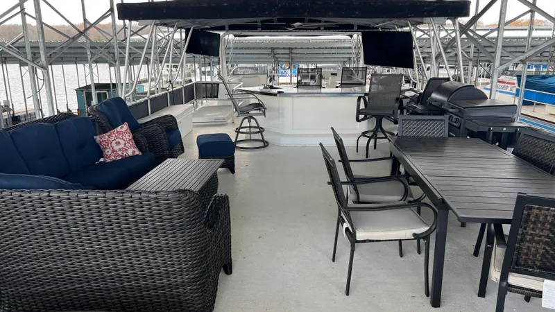Slide: The Image of Luxurious 2008 Monticello River Yacht deck with seating, dining area, and grill. - 39