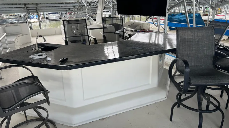 Slide: The Image of Luxurious 2008 Monticello River Yacht with sleek bar and seating area. - 40