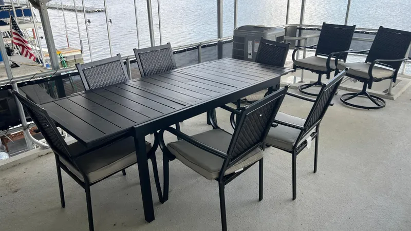 Slide: The Image of Outdoor dining set on Monticello River Yacht, 2008, overlooking water. - 41