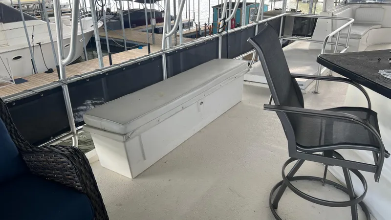 Slide: The Image of 2008 Monticello River Yacht deck with seating and table, docked at marina. - 44