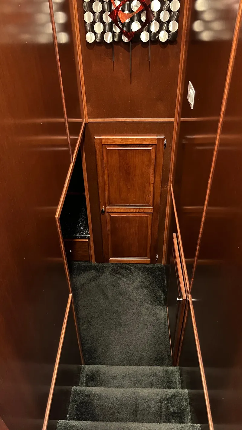 Slide: The Image of Interior of 2008 Monticello River Yacht with wooden walls and carpeted stairs. - 45