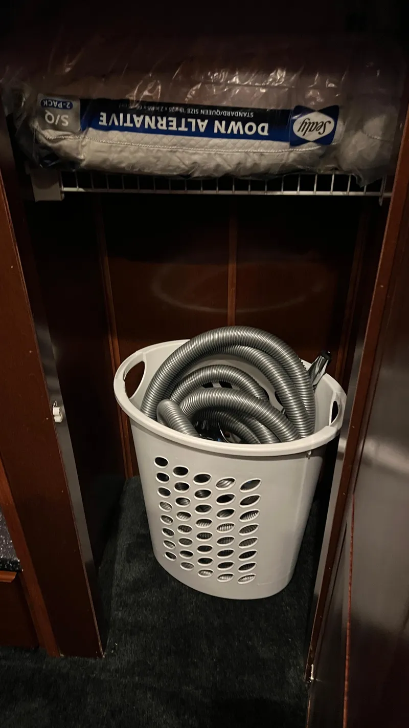 Slide: The Image of Laundry basket with hose and bedding in Monticello River Yacht closet, 2008 model. - 49