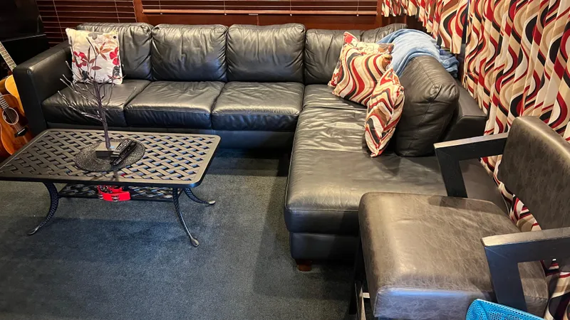 Slide: The Image of Luxurious black leather seating area on Monticello River Yacht, 2008 model. - 5