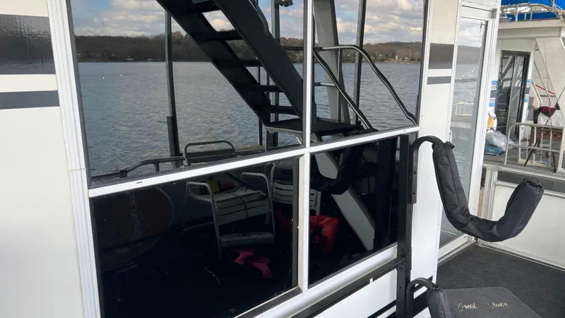Slide: The Image of 2008 Monticello River Yacht with reflective windows and lake view. - 55