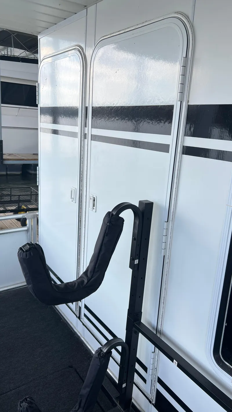 Slide: The Image of 2008 Monticello River Yacht exterior with black and white striped design. - 58