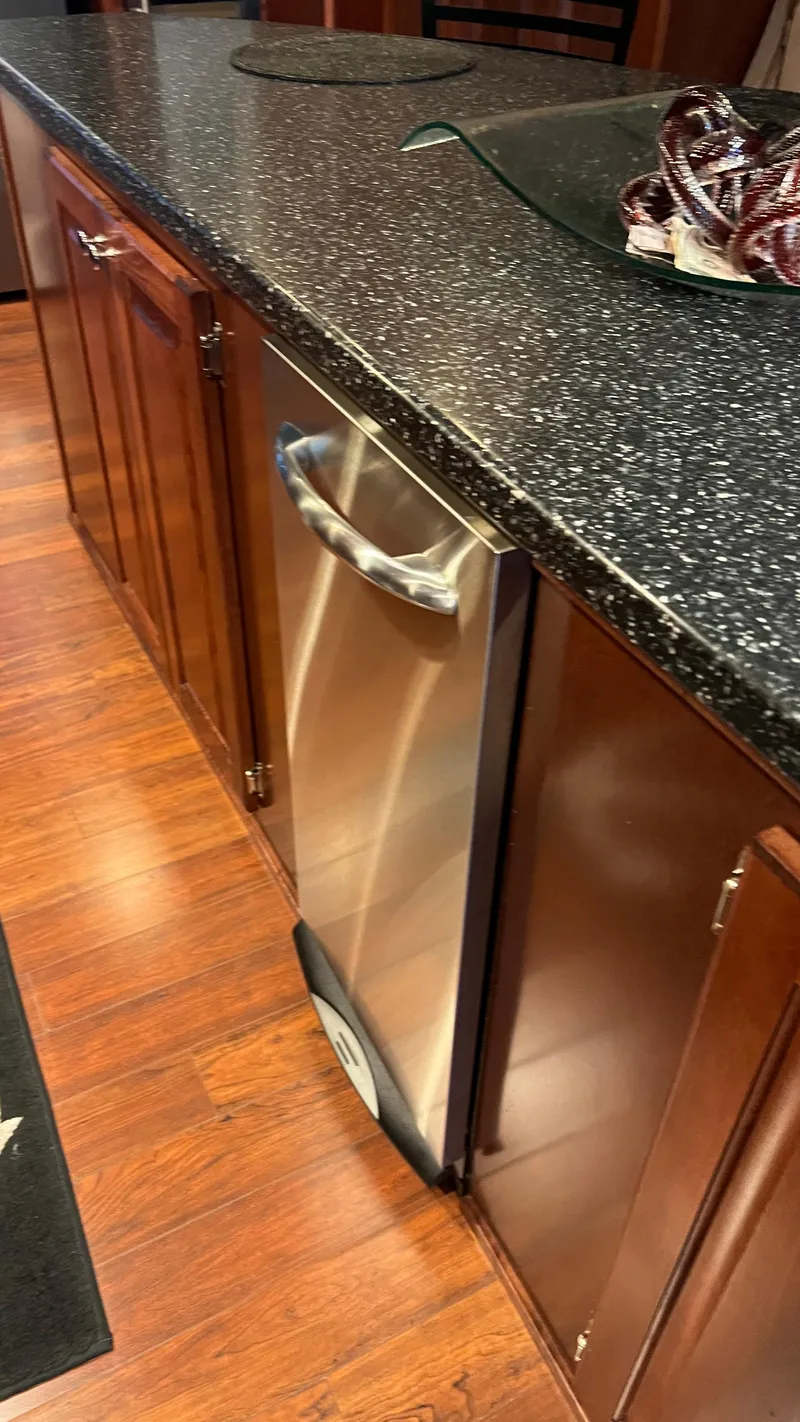 Slide: The Image of Kitchen area in 2008 Monticello River Yacht with stainless steel appliance and wooden cabinetry. - 6