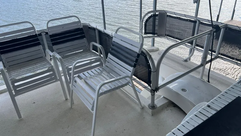 Slide: The Image of Deck chairs on 2008 Monticello River Yacht overlooking water. - 63