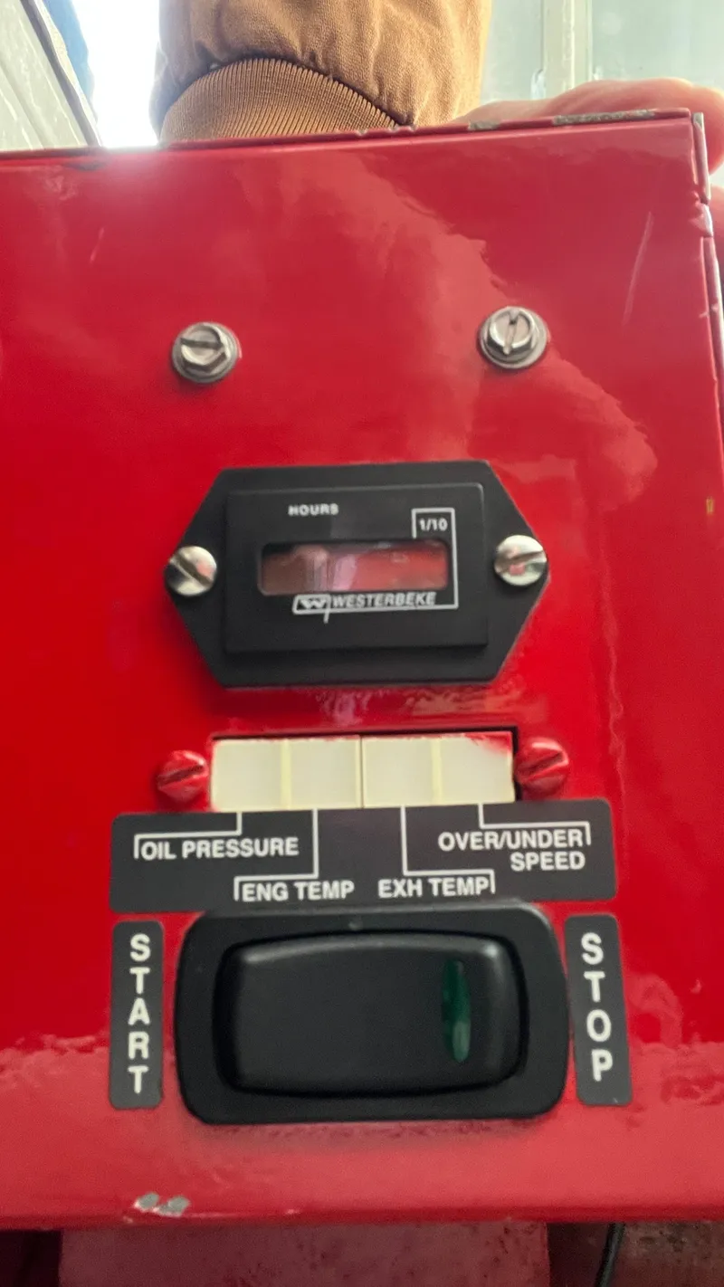 Slide: The Image of Control panel of a 2008 Monticello River Yacht with hour meter and start/stop switch. - 72