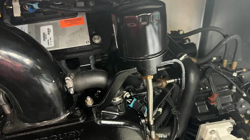 Slide: The Image of Close-up of a 2008 Monticello River Yacht engine component with visible PCM controller. - 74