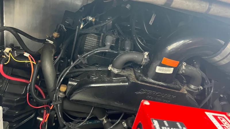 Slide: The Image of Engine compartment of a 2008 Monticello River Yacht with Mercury components. - 75