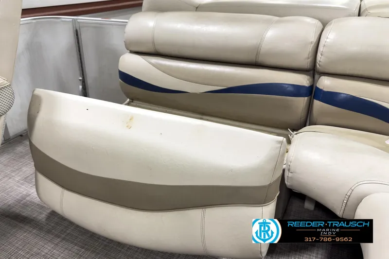 Slide: The Image of Crest Caribbean 2570 2006 boat seating with beige and blue upholstery, Reeder-Trausch Marine logo. - 22