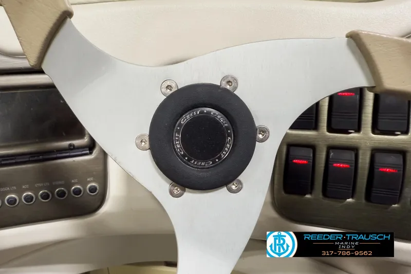 Slide: The Image of Steering wheel of 2006 Crest Caribbean 2570 boat with control panel. - 25
