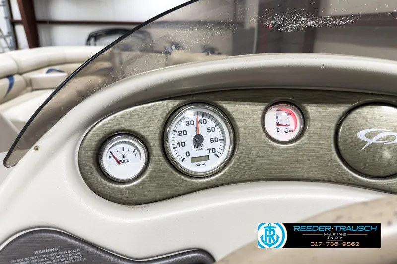 Slide: The Image of Dashboard of 2006 Crest Caribbean 2570 boat with gauges and logo. - 26