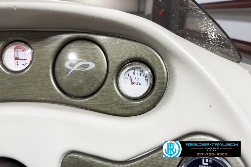 Slide: The Image of Dashboard of 2006 Crest Caribbean 2570 boat with gauges and logo. - 27