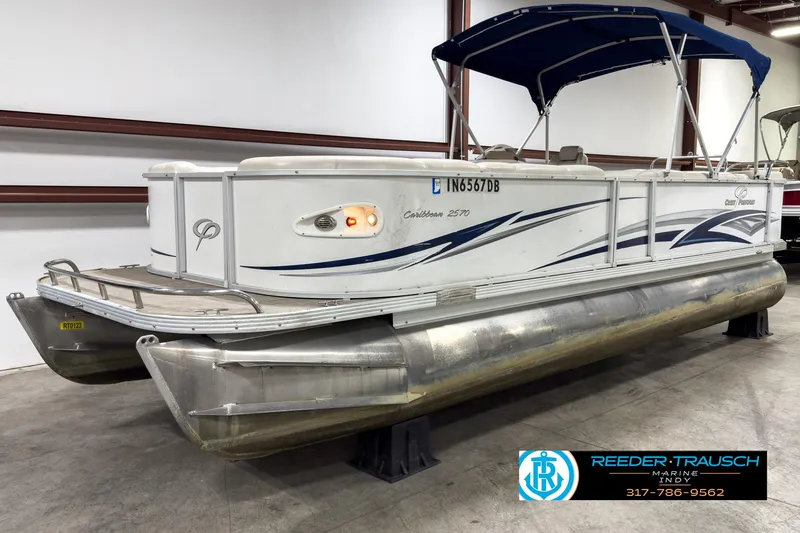 Slide: The Image of 2006 Crest Caribbean 2570 pontoon boat with canopy in indoor storage. - 3